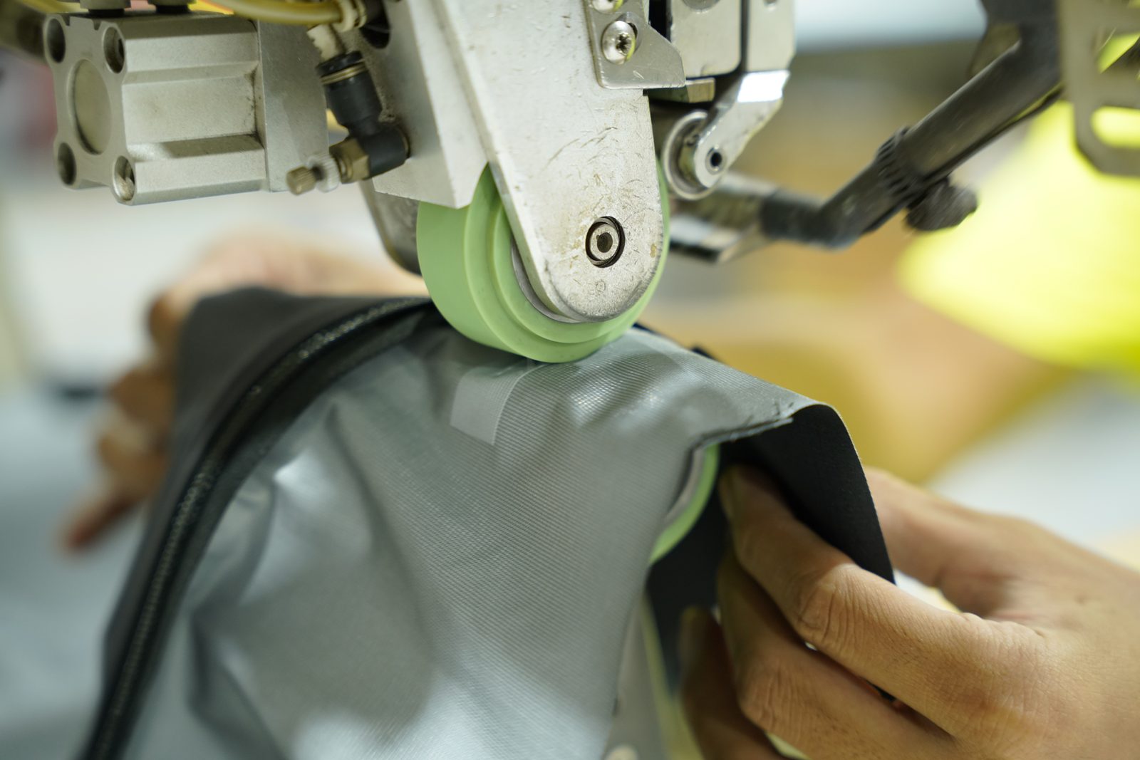 Seam tape being applied to a membrane fabric seam at Viking Vietnam