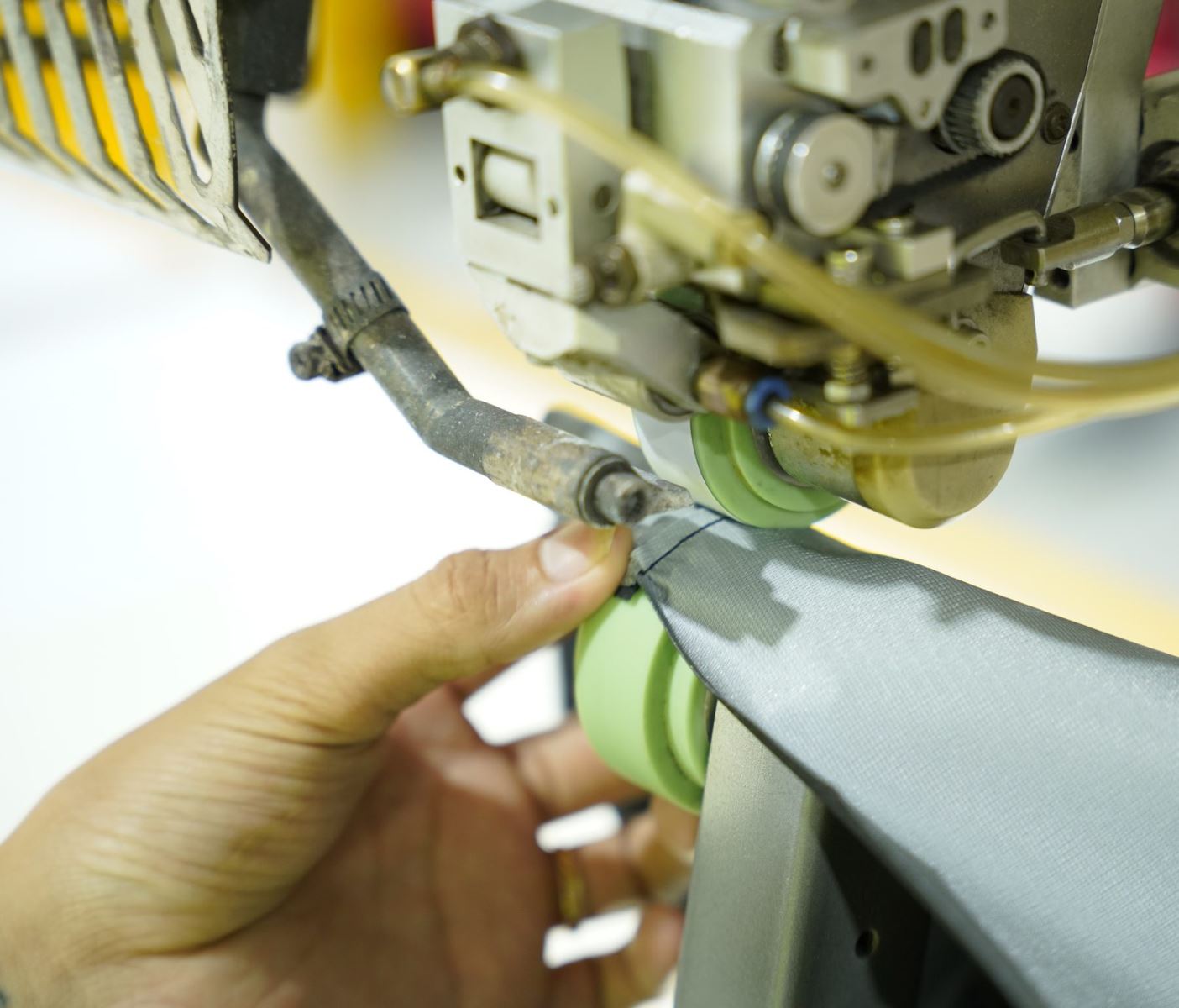 Seam sealing equipment at the Viking Vietnam factory, which has to be prepared and set to suit the material before production