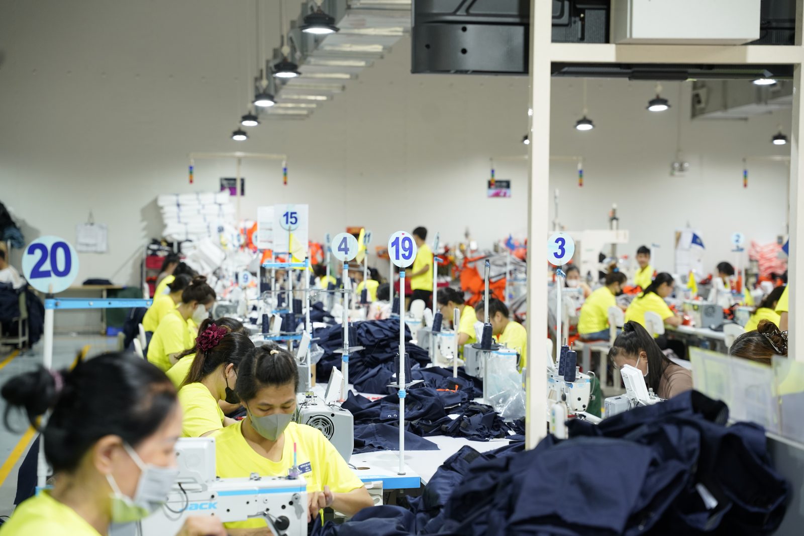 A sewing line at Viking Vietnam with numbered station signs that make it quick to identify where a problem has arisen